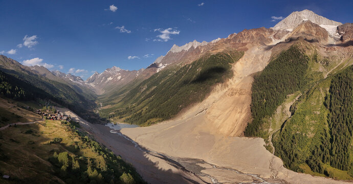 Aerial view of the aftermath of a massive rock and ice avalanche from the Birchgletscher glacier, showing the debris field covering the valley floor near Blatten, Wallis, Switzerland.