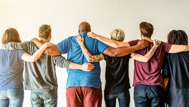 Diverse group embracing unity photo
