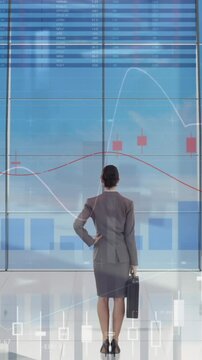 Animation of statistics and financial data processing over businesswoman in office