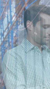 Animation of statistics and financial data processing over man working in warehouse