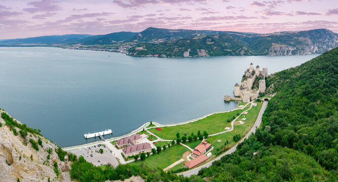 Aerial panoramic view of medieval Golubac Fortress perched on rocky cliffs above the Danube River gorge