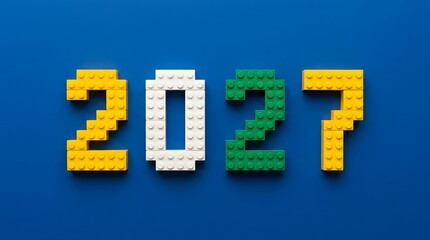 Obraz premium Year 2027 made of colorful plastic building blocks on a blue background