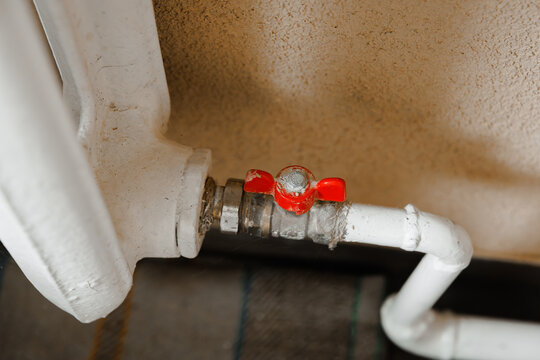 Radiator valve in residential room, home heating control and indoor temperature system concept
