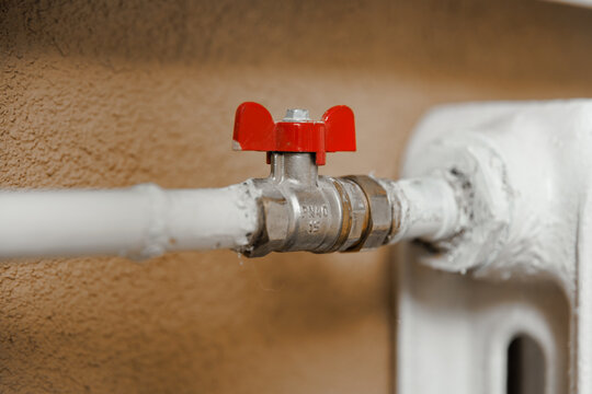 Radiator valve in residential room, home heating control and indoor temperature system concept