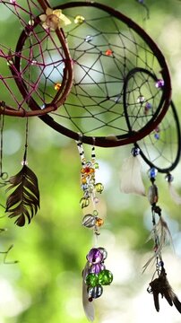Handmade dreamcatcher with feather and colorful bead decoration