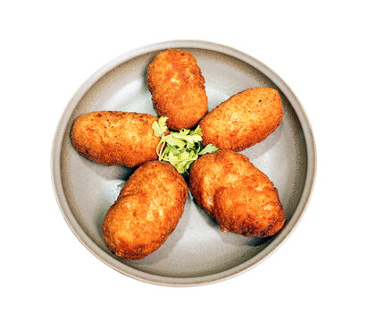 plate of golden-brown, crispy fried croquettes