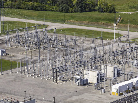 Aerial view of a high voltage electrical substation at a data center featuring metal power structures, transformers, and concrete pads in Clarksville, Tennessee, United States.
