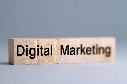 Digital marketing text on wooden blocks. Business strategy and online advertising concept. Building a foundation for internet promotion