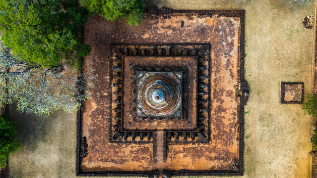 Aerial view of the ancient stupa and surrounding brick ruins at Si Satchanalai Historical Park, Si Satchanalai, Sukhothai, Thailand.