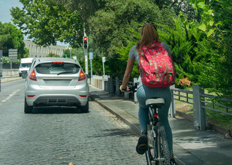 Naklejka premium Cyclist traveling through Evora streets