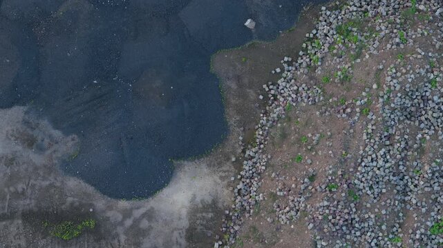 Aerial top down view of industrial slag and rocks