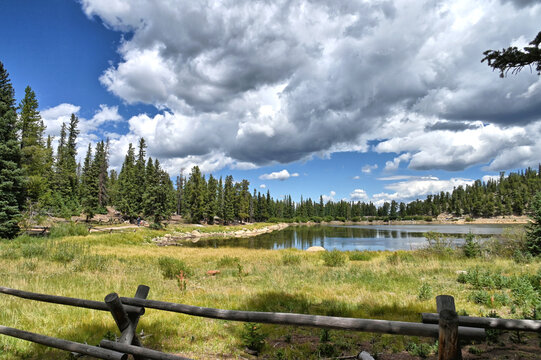 Echo Lake in the Colorado Rocky Mountains with pine trees, blue sky and clouds, Idaho Springs CO