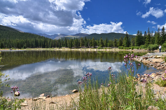 Echo Lake in the Colorado Rocky Mountains with pine trees, blue sky and clouds, Idaho Springs CO