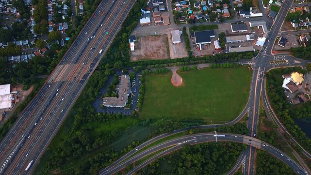 Vast cityscape of Middlesex County, New Jersey with lush greenery. Lively highways cross the scenery. Top view.