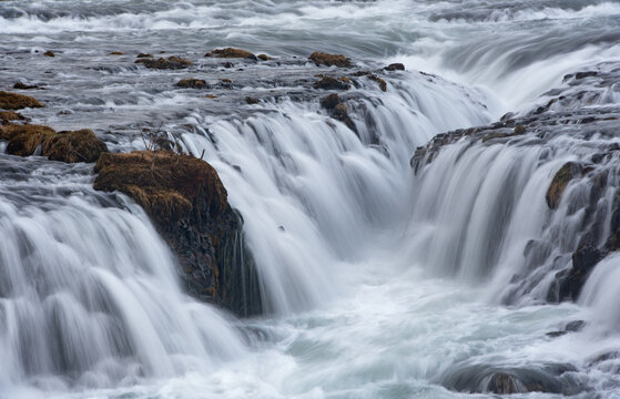 Powerful water surging and cascading over black rocks, . Bruarfoss waterfall Iceland
