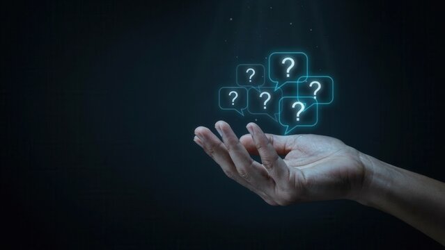 Human hand holding floating neon blue question mark icons representing uncertainty, confusion, curiosity, and critical thinking in digital space