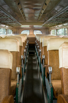 Brown Seats on Either Side of Bus Aisle