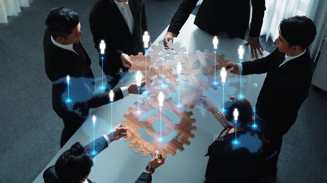 A diverse business team collaborates on a project, utilizing gear elements and digital icons to symbolize innovation, connectivity, and strategic planning in the workplace. Raster