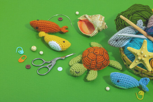 Set of clew of thread for knitting. Crocheted different underwater animals, marine hobby concept