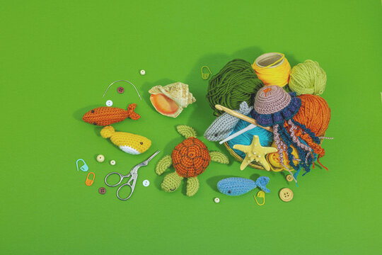 Set of clew of thread for knitting. Crocheted different underwater animals, marine hobby concept
