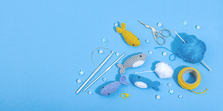 Set of clew of thread for knitting. Crocheted different fishes, handmade, sea hobby concept
