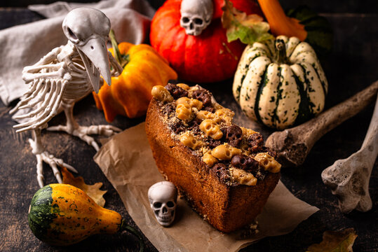 Halloween pumpkin cake decorated with skull