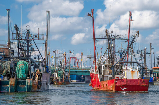 World&rsquo;s Most Lucrative Fishing Port:  A large commercial fishing boat angles toward a docking space in the harbor at New Bedford, Massachusetts.

