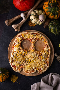 Halloween scary pizza in shape of ghost. Party food