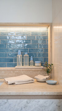 Luxury Spa Countertop Mockup with Illuminated Low Wall Niche and Blue Glazed Tile Backwall