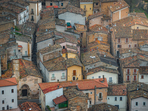 Aerial view of the historic stone buildings and terracotta rooftops in the village of Anversa degli Abruzzi, Abruzzo, Italy.