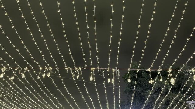 Decorative Warm White LED Light Canopy Against Dark Night Sky
