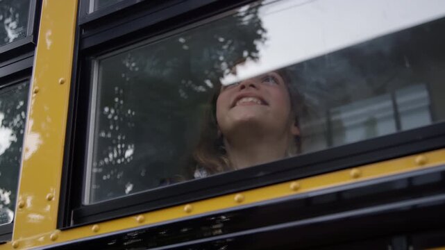 Iconic school bus driving kids to school and class