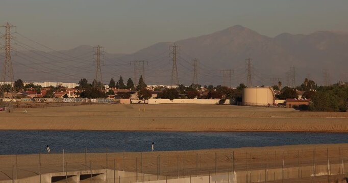 Fontana, California, USA - November 9, 2024: Water stands in a recharge basin in the Declezville neighborhood.