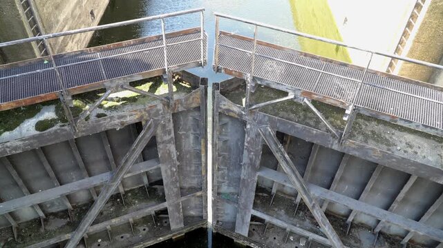 Closed steel mitre lock gates on water canal