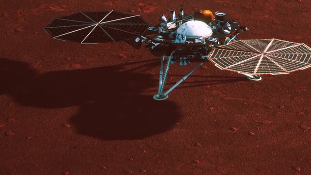 A spacecraft is on the surface of Mars. It is conducting tests and gathering data. The landscape is red and rocky. Shadows from the equipment stretch on the ground.