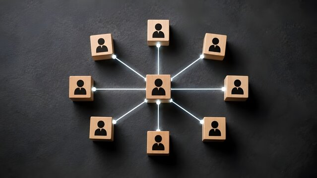 Organizational structure and team management concept featuring wooden blocks with human icons connected by glowing lines on dark background