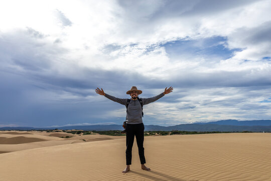 Young Latin Man Exploring the Desert Sand Dunes During Vacation in Falcon State, Venezuela