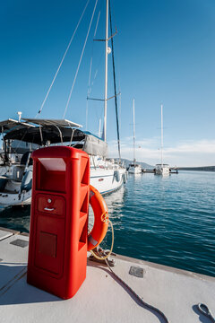 yachts docked in modern marina with shore power and water pedestals