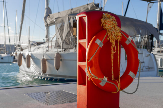 yachts docked in modern marina with shore power and water pedestals