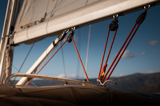 View from cockpit of sailing yacht heeling in open sea during summer travel