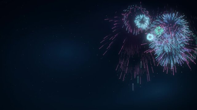 Colorful fireworks bursting in a dark night sky with falling sparks and open copy space
