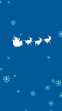 Animation of falling snow over santa claus in sleigh with reindeer