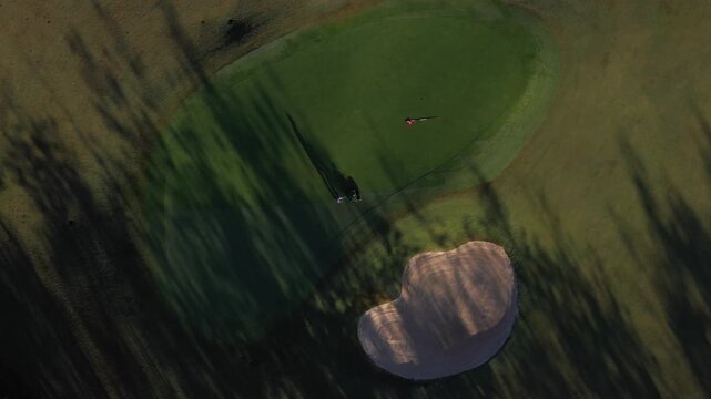 Aerial drone view of SAM Tuyen Lam Golf Club in Da Lat, Vietnam, showcasing lush fairways surrounded by pine forests and mountain scenery in the scenic Tuyen Lam Lake area.