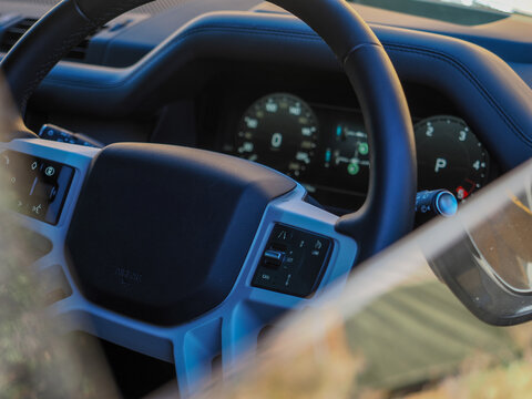 Steering wheel and digital dashboard in modern SUV, copy space