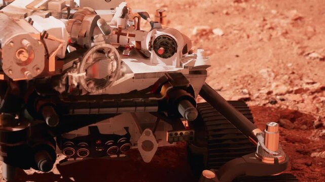 A robotic rover is moving over the rocky surface of Mars. It is equipped with tools for analysis and sample collection. The sun is bright, showcasing the red soil and rugged terrain.
