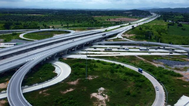 Modern transportation interchange with intricate road structures provides efficient vehicle circulation and connectivity, representing smart infrastructure, urban development, engineering innovation, 