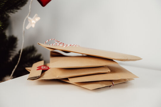 pile of Advent Calendar paper bags with gifts for Christmas .winter holidays traditions