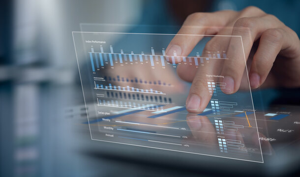 Digital marketing data analysis with financial report on virtual screen. Using digital tablet for e-commerce business planning and strategy, data visualization and market research