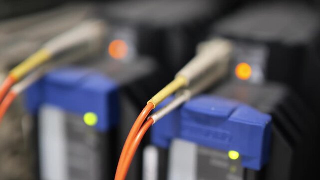 Advanced optical communication equipment converting electronic signals to optical signals through fiber optic cable, representing telecommunications, network infrastructure, high speed connectivity, d