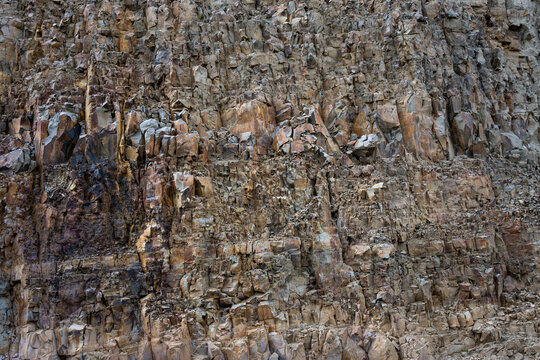Fractured rock cliff wall as a pattern and texture nature background, Yellowstone National Park
